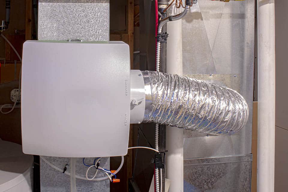 A home humidifier attached to the return duct with a bypass connection to the supply hot air duct. A home humidifier attached to the return duct with a bypass connection to the supply hot air duct.